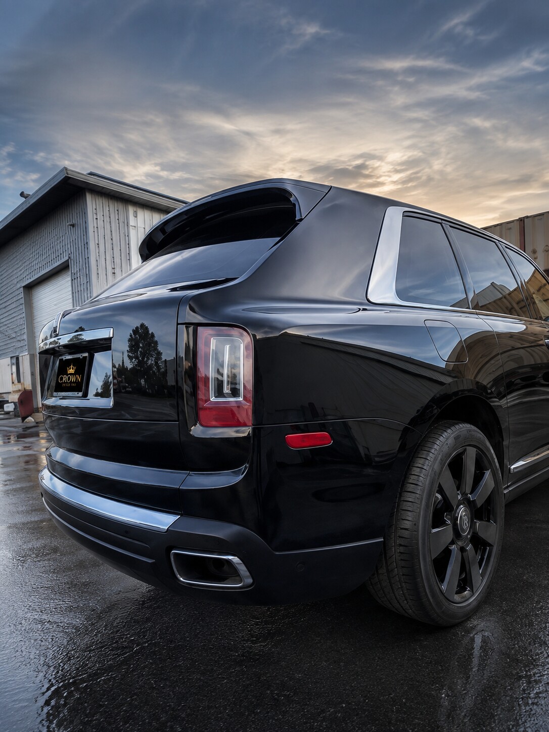 Finished black luxury SUV after exterior detailing